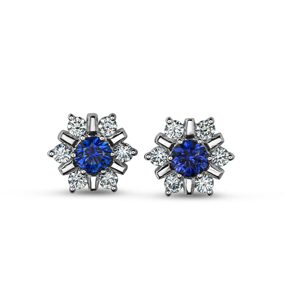 18 K WHITE GOLD snowflake design set center a blue sapphire and surrounded in diamonds carati jewelry montreal