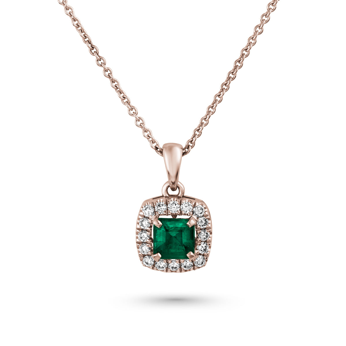 An elegant square pendant necklace with a central emerald surrounded by pave diamonds in sophisticated spark designed by carati jewelry in montreal canada in 18 k 14 k 