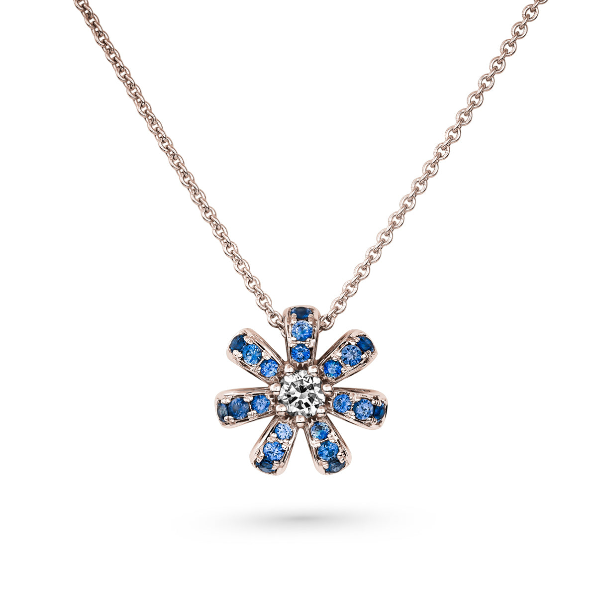 Fiora mini pendant set in pave blue sapphires and a Sparkling diamond in the middle is iconic design from carati jewelry in montreal canada in 1k 14 k