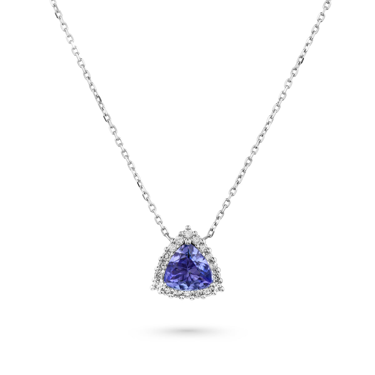 A trillion-shaped tanzanite pendant surrounded by a halo of sparkling diamonds, suspended from a chain designed by carati jewelry montreal canada in 18 k 14 k pendants 