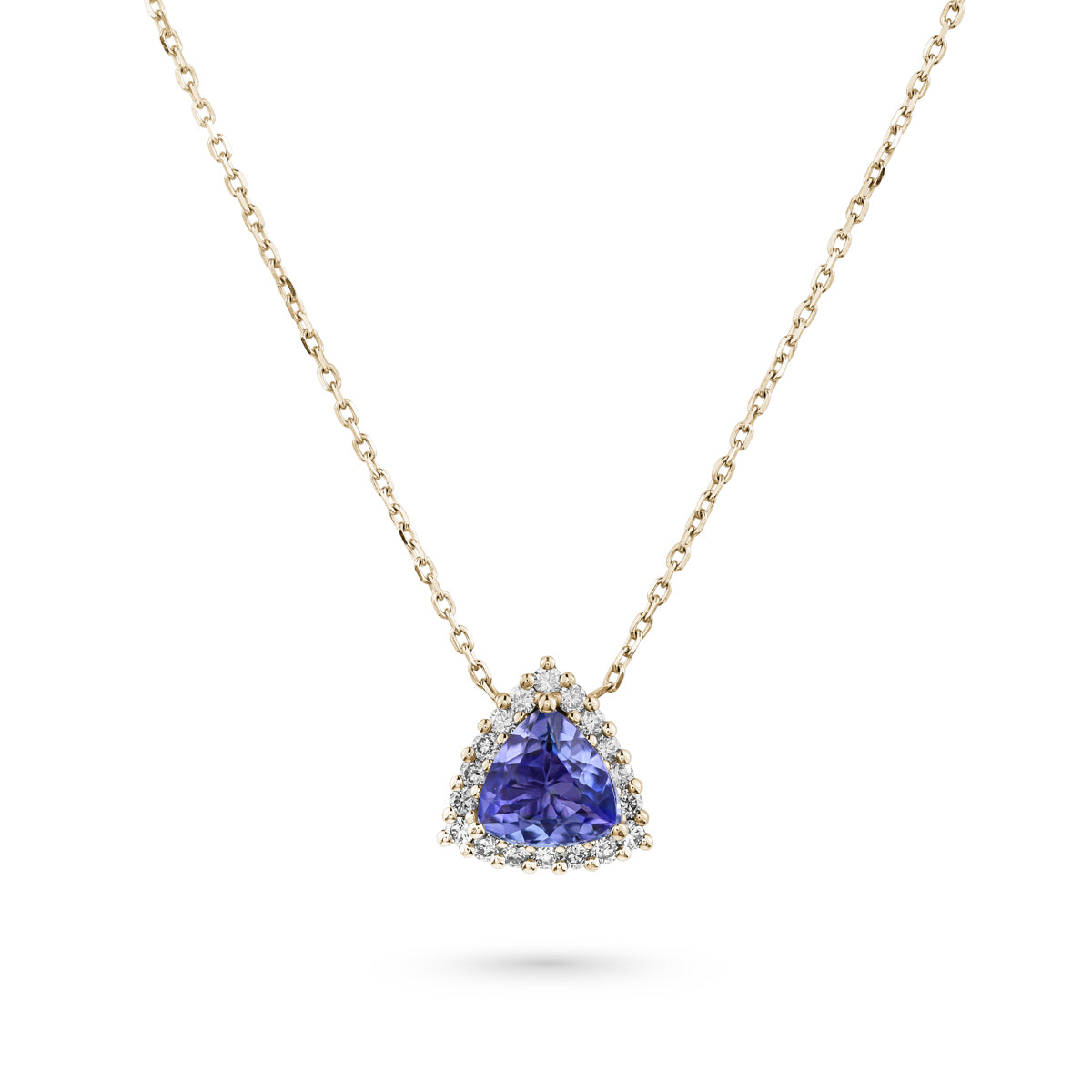 A trillion-shaped tanzanite pendant surrounded by a halo of sparkling diamonds, suspended from a chain designed by carati jewelry montreal canada in 18 k 14 k pendants 