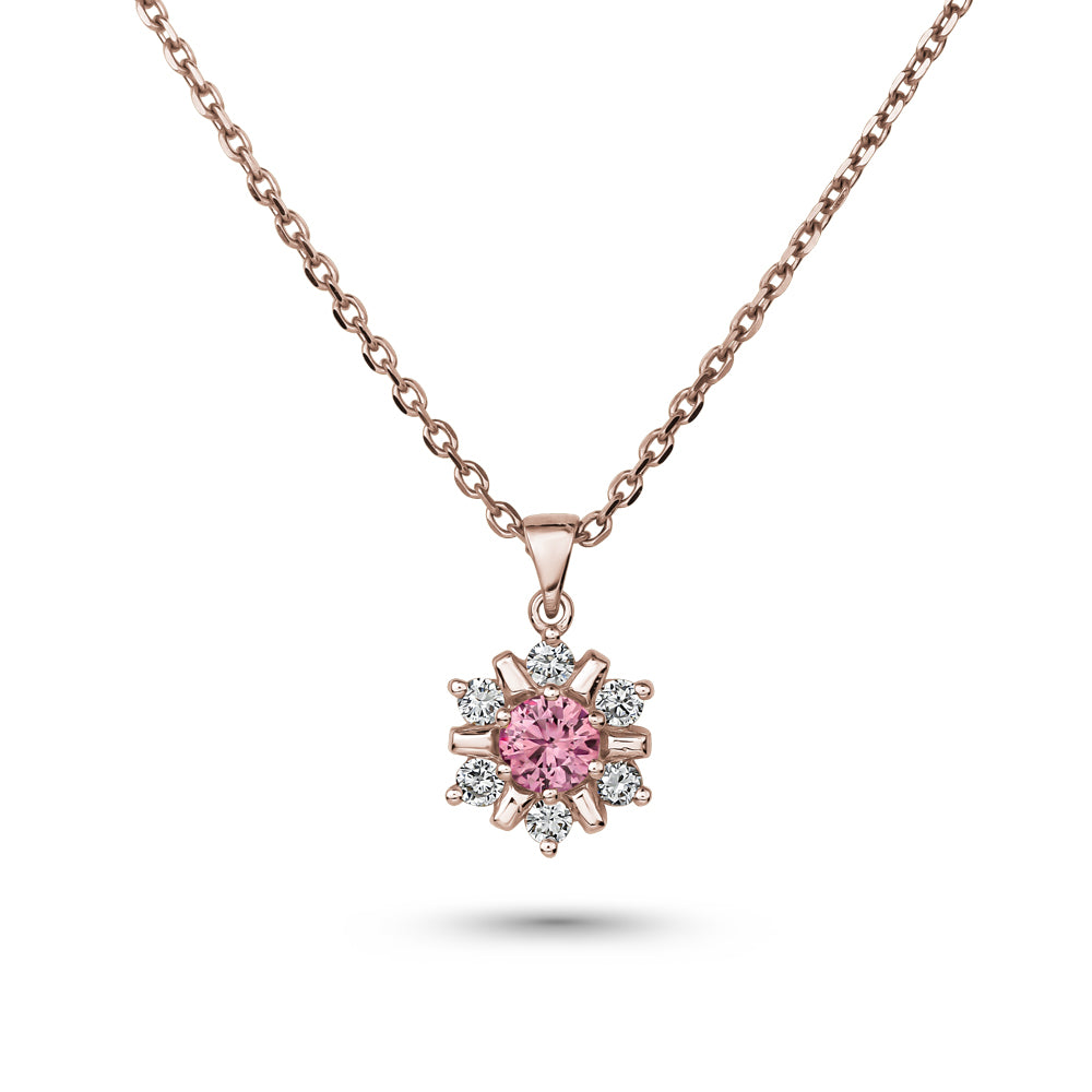 18k rose gold snowflake pendant with pink sapphire in the middle and  set around  in diamonds carati jewelry montreal