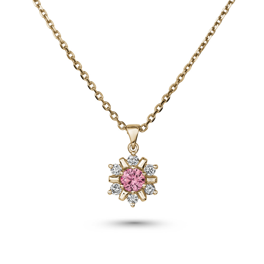18k yellow gold snowflake pendant with pink sapphire in the middle and  set around  in diamonds carati jewelry montreal