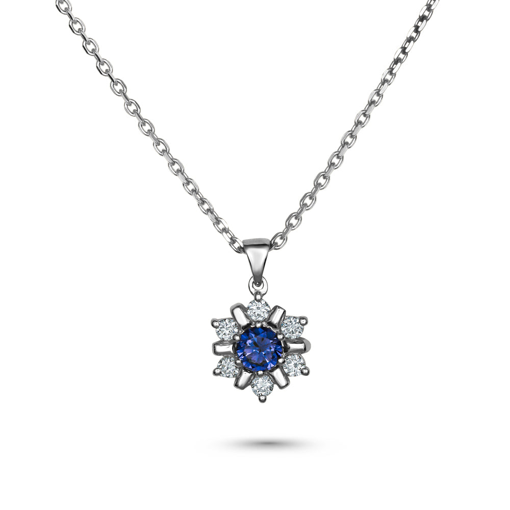 18k white gold snowflake pendant with blue sapphire in the middle and  set around  in diamonds carati jewelry montreal
