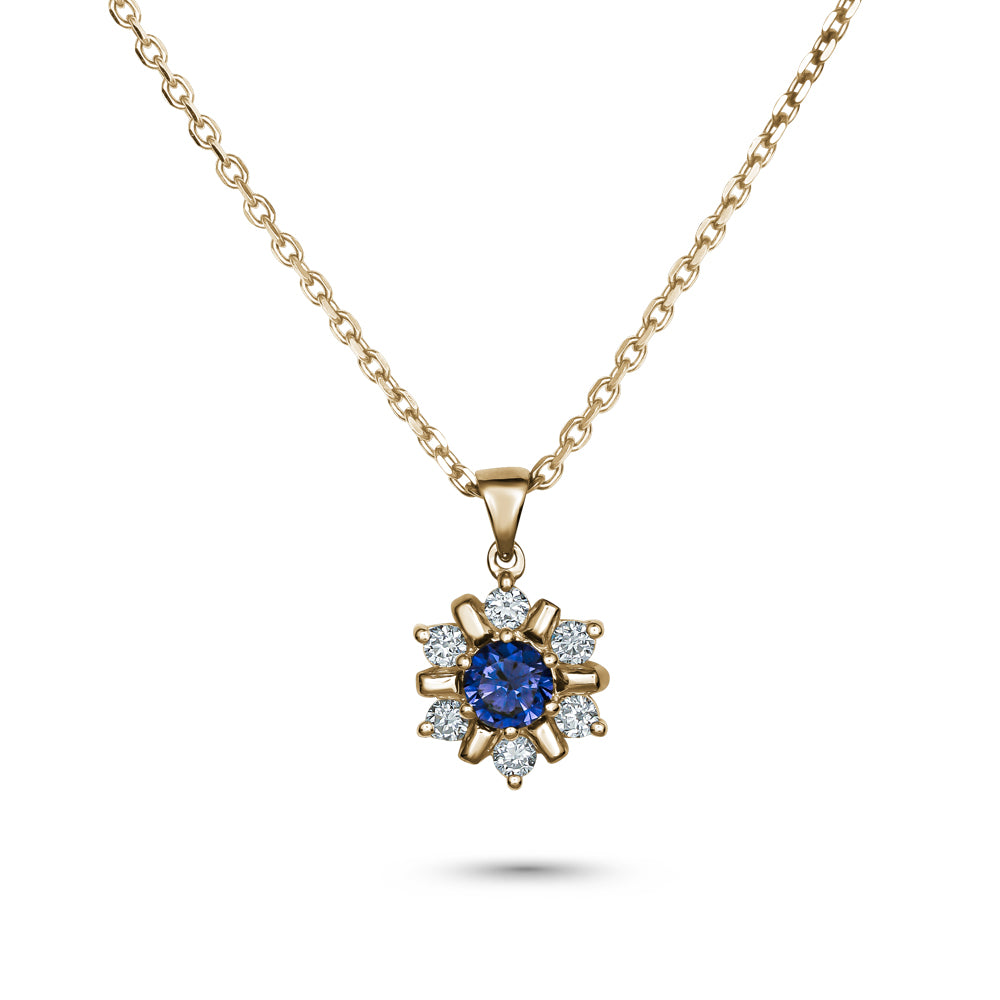 18k yellow gold snowflake pendant with blue sapphire in the middle and  set around  in diamonds carati jewelry montreal