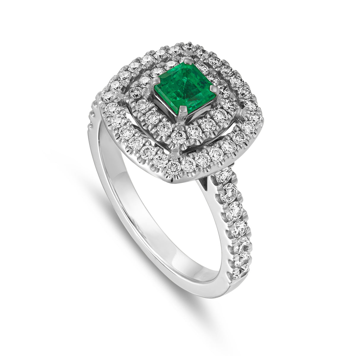 A square emerald set in a double halo ring with a setted shank designed by carati jewelry in 14k 18 k in vs diamonds