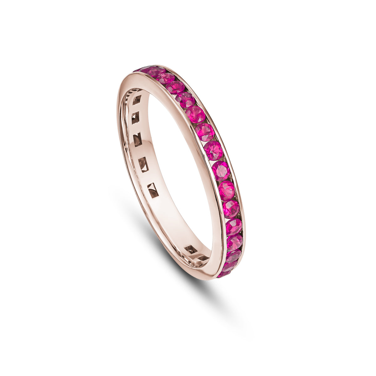 A gold wedding band featuring a channel set of full rubies, with a total of 14 rubies visible in the image.wedding bands channel set rubies diamonds