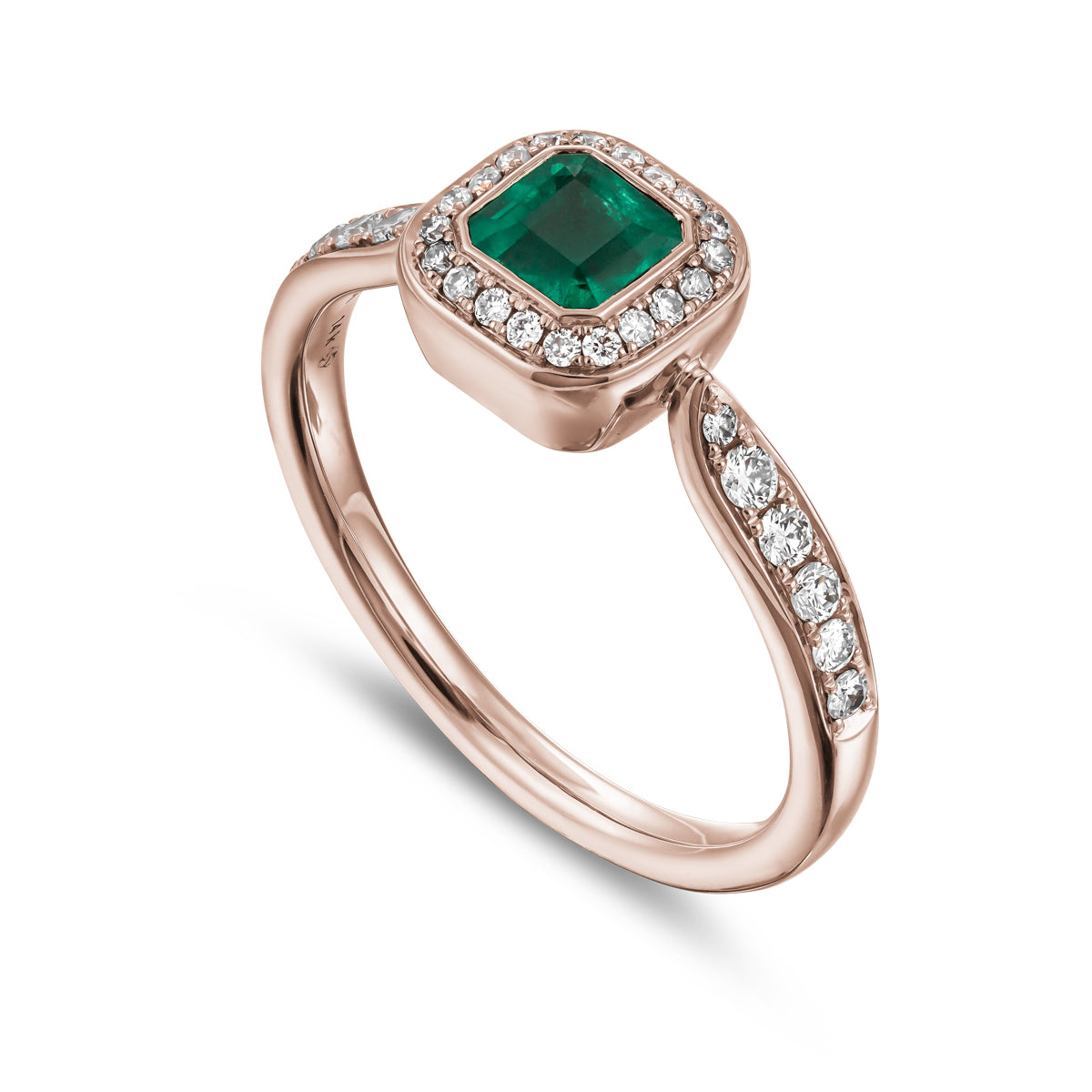 Royal harmony ring with tie emerald surrounded by pave diamonds and on the shank designed by carati jewelry in montreal canada 18k 14 k