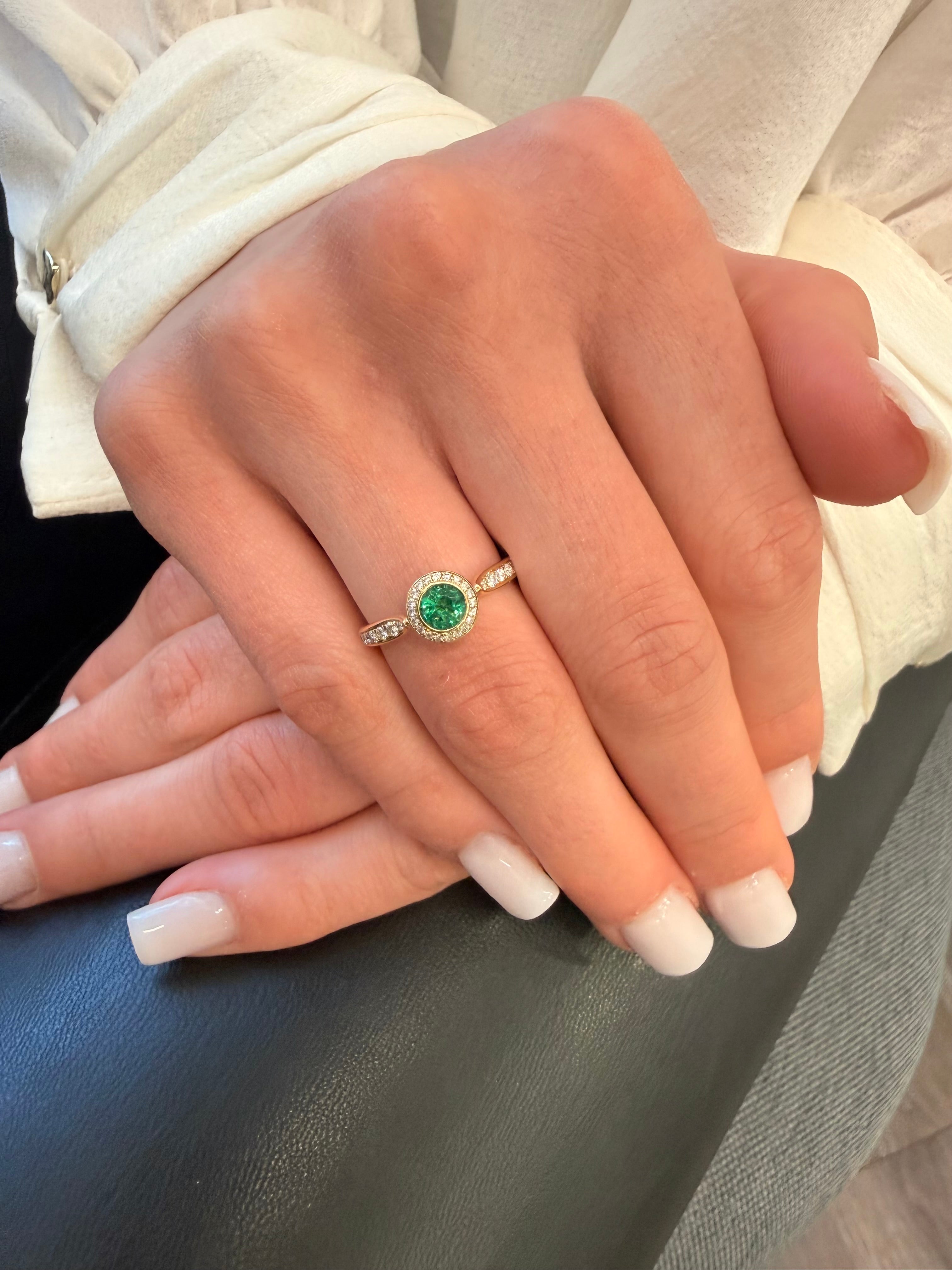 Royal Harmony Ring Centered an Emerald and Diamonds on Shank