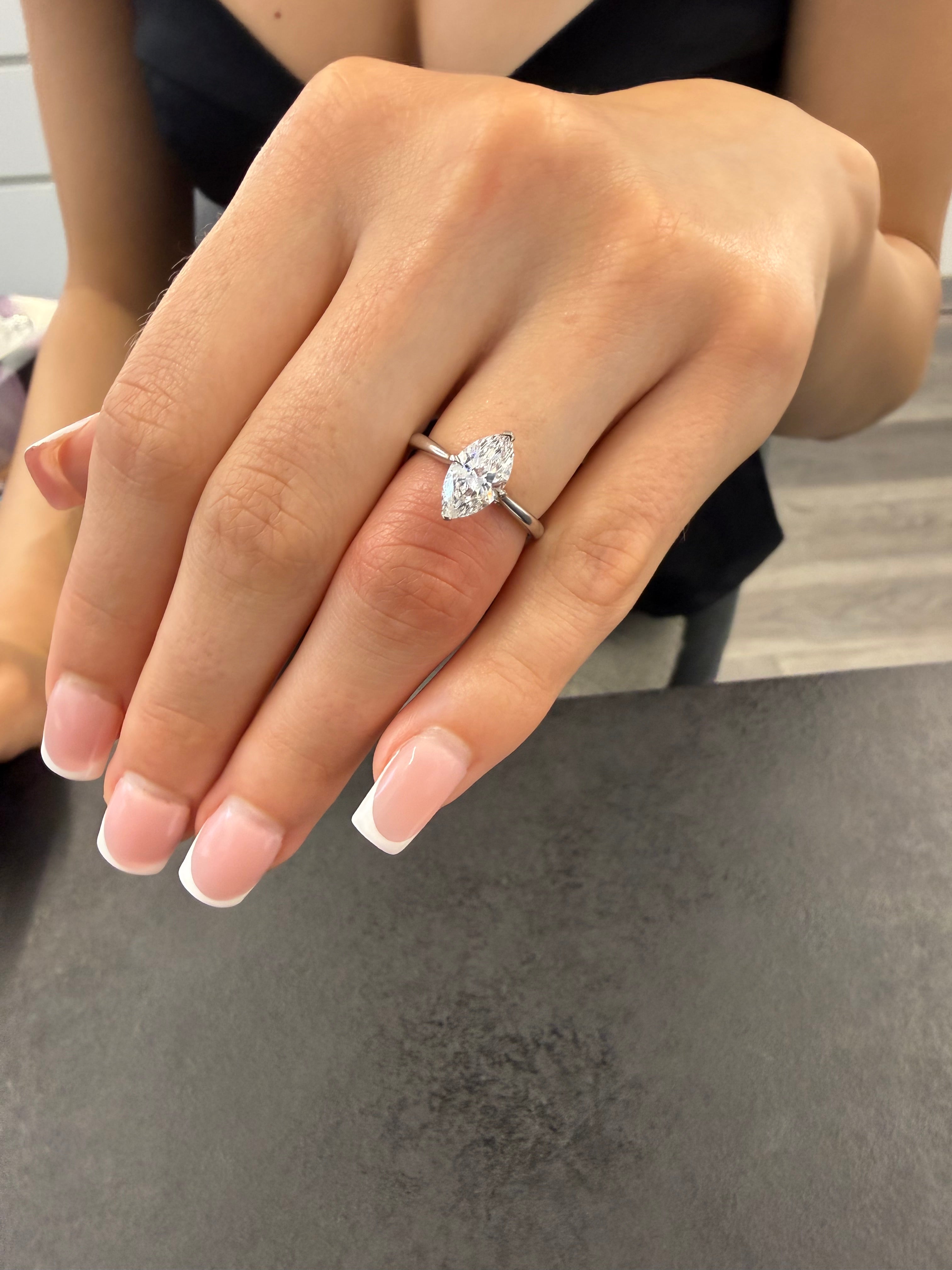 Marquise Engagement Ring Set In V Prongs With Diamonds On The Bridge