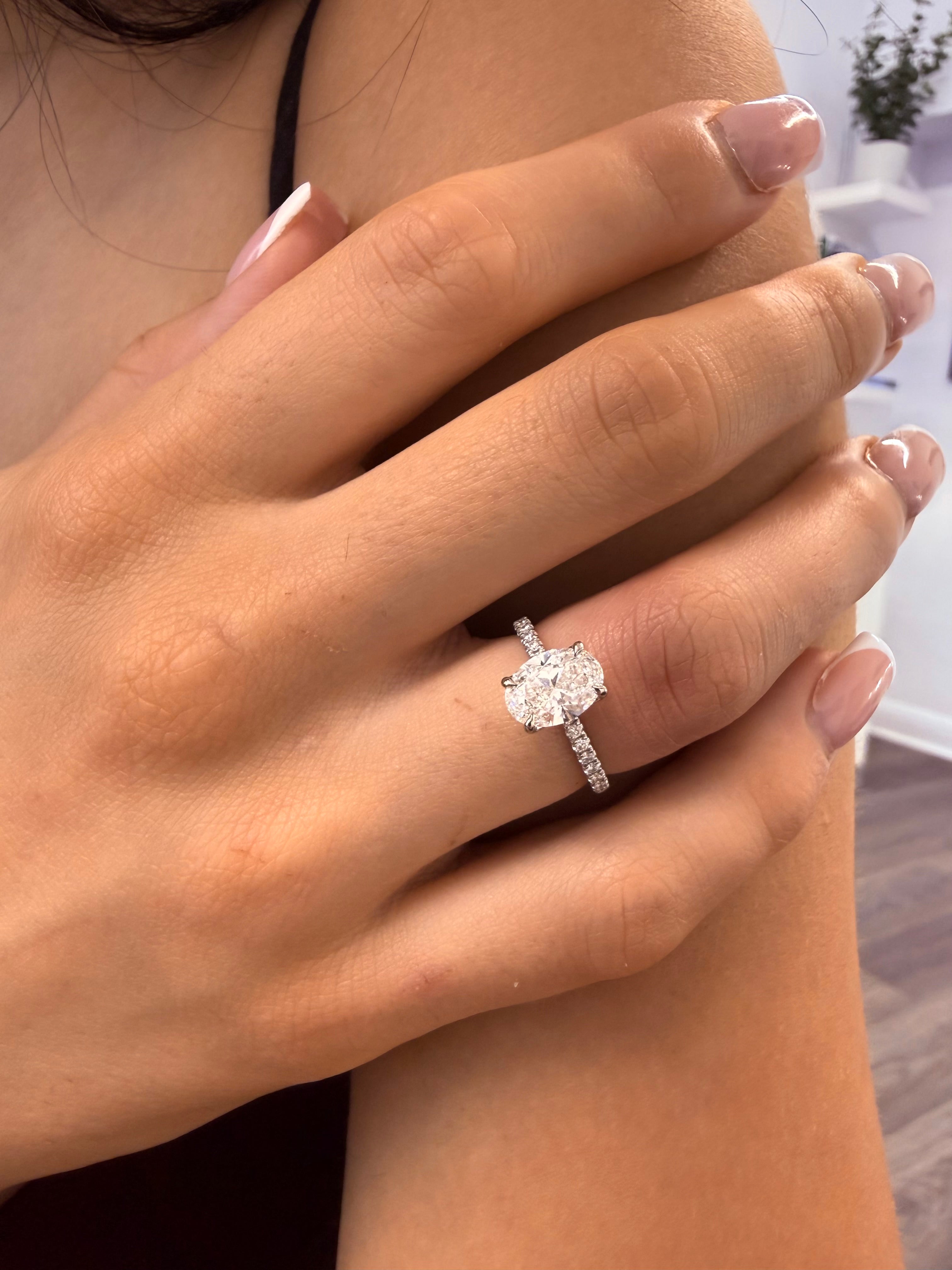 Oval Engagement Ring Set In Petal Prongs And Side Pave