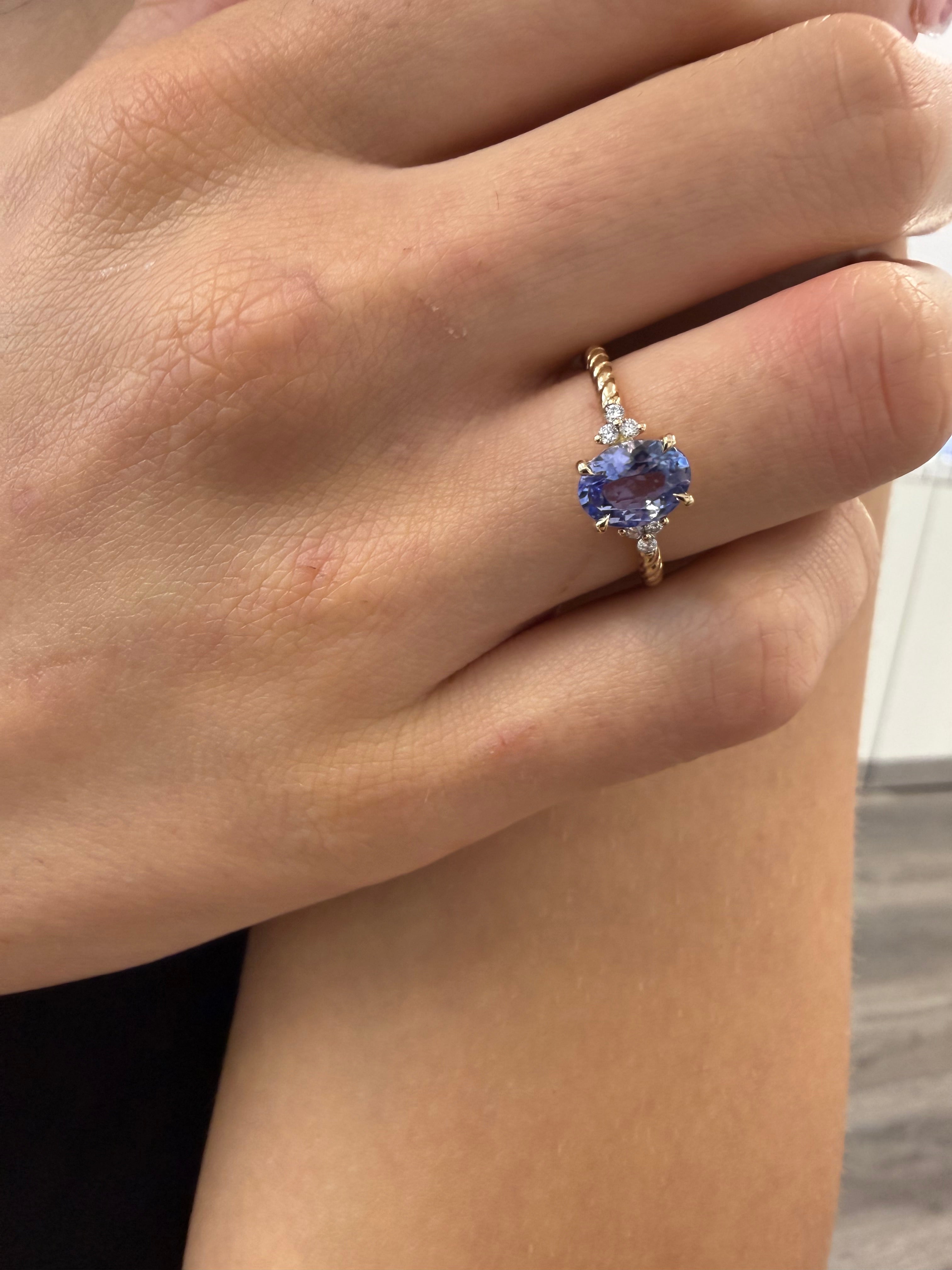 Oval Tanzanite Gem Set On Twisted Shank With 3 side Sparkling Diamonds