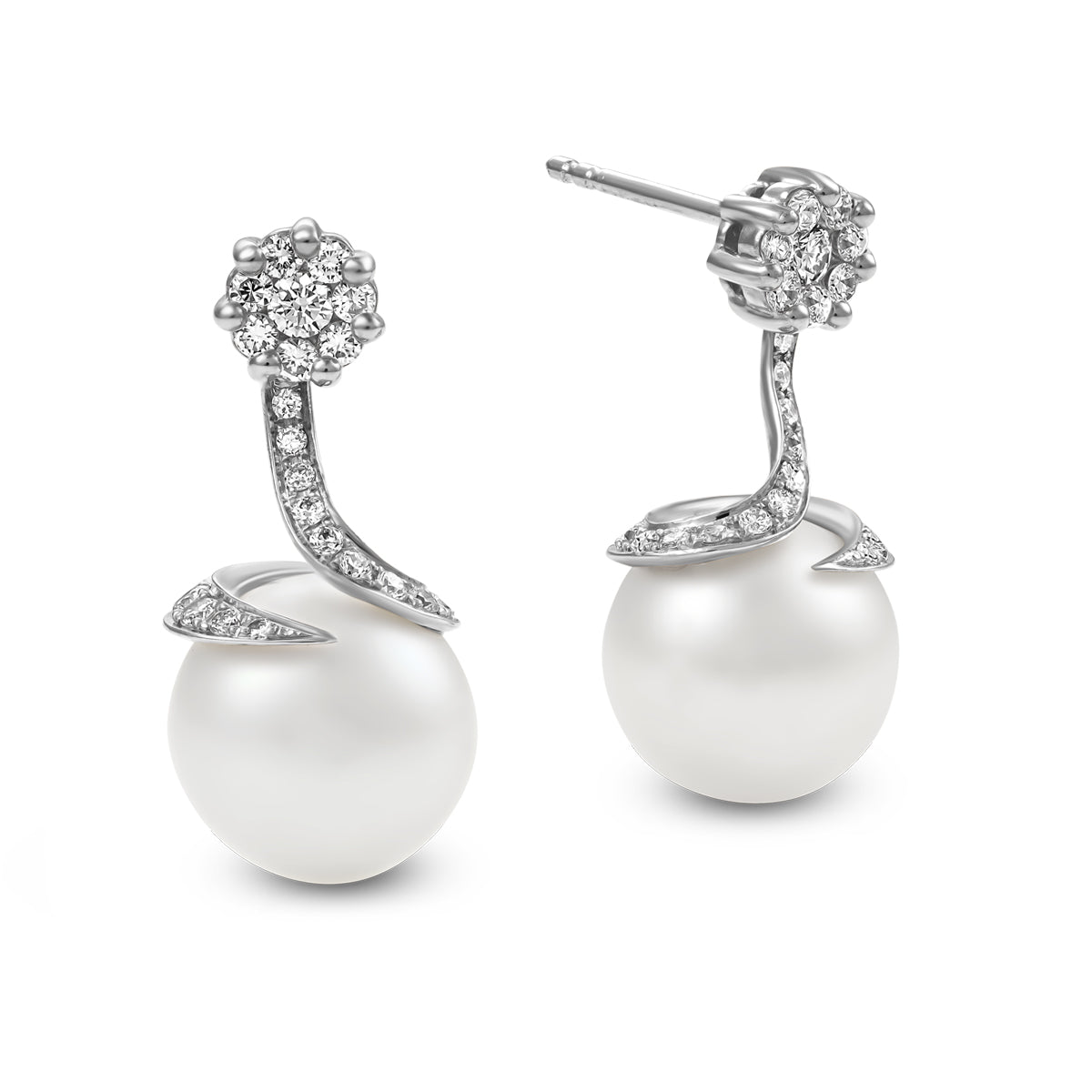 Spirale earrings with natural south sea pearl with pave set diamonds in spirale design ,designed by carati jewelry montreal canada 18 k 14 k